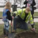 One of the littlest scouts helps Public Works dig a hole.