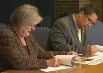 Dr. Laura Coleman and Duane Bedell sign the articulation agreements