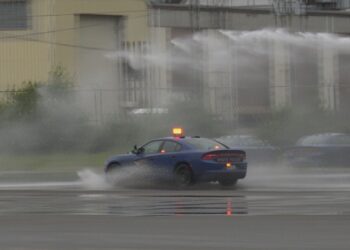 A patrol vehicle goes through the skid control exercise