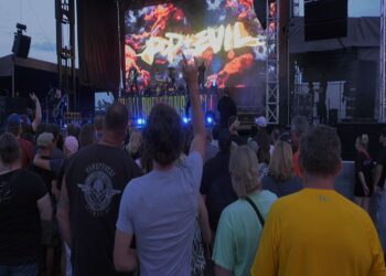 Attendees watch Rock Night headliner Pop Evil from the pit.