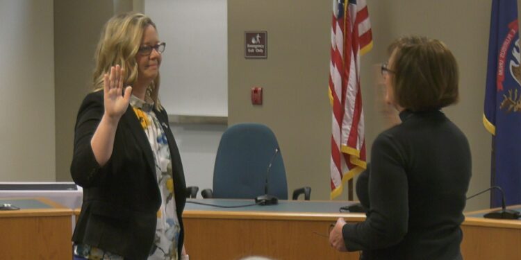 New District 4 Commissioner Kelli Van Ginhoven takes her oath of office.