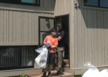 NMU Crews remove debris from flooded apartments