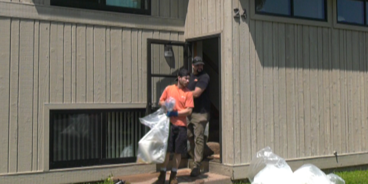 NMU Crews remove debris from flooded apartments