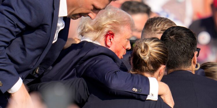 The Secret Service said in a statement that former president Donald Trump is “safe” and that the incident is being investigated after Trump was rushed offstage with blood on his ear and face after a shooting during his Saturday evening rally in Butler, Pennsylvania. (Photo: Gene J. Puskar/AP via CNN Newsource)