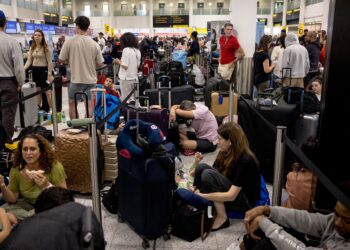 (Jack Taylor/Getty Images via CNN Newsource) Widespread IT problems are currently impacting global travel. Pictured here: passengers at London's Gatwick Airport amid the disruption.