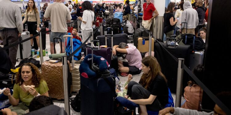 (Jack Taylor/Getty Images via CNN Newsource) Widespread IT problems are currently impacting global travel. Pictured here: passengers at London's Gatwick Airport amid the disruption.