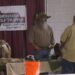 Antczak talks with an attendee at his booth.