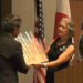 Marquette Mayor Sally Davis presents Mayor Ogura with artwork