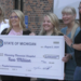 Representative Jenn Hill presents a check to Munising Memorial Hospital.