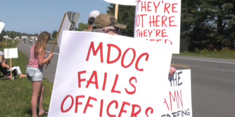 Dozens of corrections officers walk the picket line in Baraga