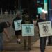 (Andrew Chin/Getty Images via CNN Newsource) Teamsters union members hold picket signs at the entrance of CN Rail Lynn Creek Yard in North Vancouver, British Columbia, Canada.
