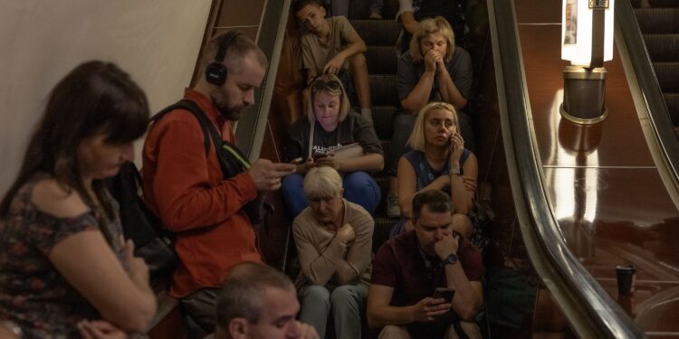 (Roman Pilipey/AFP/Getty Images via CNN Newsource) People take shelter in the Tealtralna metro station in Kyiv, Ukraine, August 26, 2024.