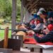 (Credit: Michigan Department of Natural Resources) Women practice shooting at a Becoming an Outdoors-Woman fall weekend workshop in Marquette County. Registration is open for an Oct. 11-13 event at the Bay Cliff Health Camp north of Marquette.