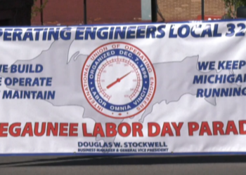 Union members march in Negaunee Labor Day Parade