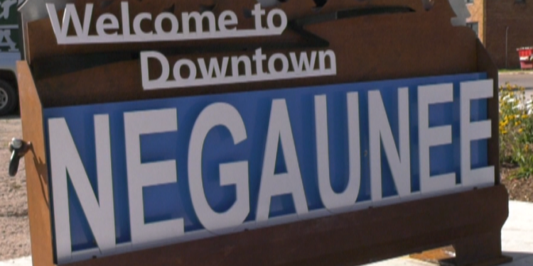 NEGAUNEE CITY OFFICIALS ANNOUNCED YESTERDAY THE COMPLETION OF THE STREETSCAPE PROJECT, AN AMBITIOUS 3.4 MILLION DOLLAR RENOVATION OF THEIR DOWNTOWN. BEGINNING WITH AN OVERHAUL OF THE SEWER AND WATER LINES, REPAVING OF THEIR MAIN THOROUGHFARES, NEW SIDEWALKS, AND IMPROVED LIGHTING.