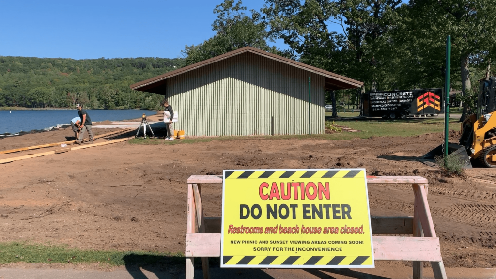 A sign cautions park visitors from entering the construction area as the Lake Antoine Park Partners work to make the beach area more handicap accessible.