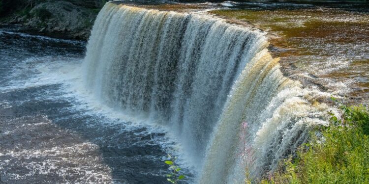 (Credit: Michigan Department of Natural Resources) The 200-feet-wide Upper Falls, located in Tahquamenon Falls State Park, is one the largest waterfalls east of the Mississippi River.