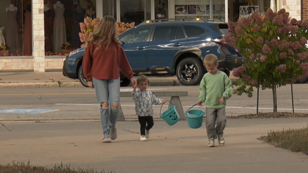 Shepard and his sister with their Teal Pumpkin buckets