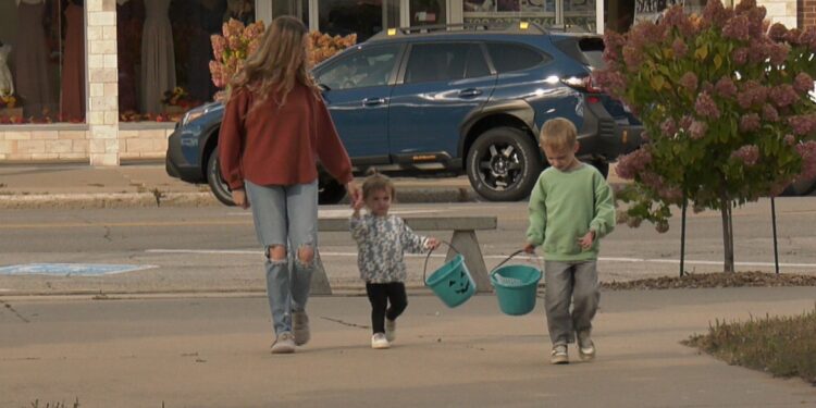 Shepard and his sister with their Teal Pumpkin buckets