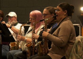 Members of the Escanaba City Band rehearse for next week's performance