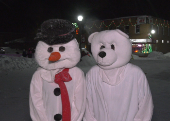 The streets of Munising were alive tonight with the spirit of Christmas. The Rekindle The Spirit Festival kicked off the holiday season on Thursday. Munising's Christmas tree was officially lit this evening by none other than Santa Claus himself. The lighting of the tree is the official start of the holiday season and the start of the annual Rekindle The Spirit Festival here in downtown Munising. With the falling snow and all the festive lights on area businesses, Munising was transformed into a winter wonderland. CEO of the Alger County Chamber of Commerce, Dr. Kathy Reynolds says the hearty residents of Munising came out despite the weather. "Things, I think went really well. You know, the weather's been a little bit tricky, so we were kind of concerned about that leading up to this, but we had a nice crowd come out tonight, and the businesses really put on a nice show for everybody," said Dr. Reynolds.