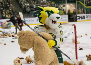 The Northern Michigan University Student Athletic Advisory Committee and The Mining Journal Cheer Club held a teddy bear toss during the NMU / Ferris State Hockey game this evening. Spectators were asked to bring in a stuffed animal to donate to less fortunate children this holiday season. a cascade of toys was tossed onto the ice where they were collected, sorted, and donated to St.Vincent DePaul and the Salvation Army for distribution to area boys and girls. Salvation Army board member Jim Reevs says these donated teddy bears might be some child's only gift this Christmas.