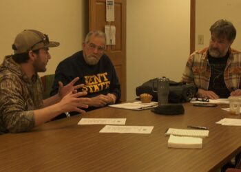 Forester Ben Marchant talks with board members Glenn VandeWater and Joe Kaplan.