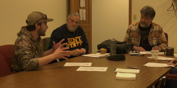 Forester Ben Marchant talks with board members Glenn VandeWater and Joe Kaplan.