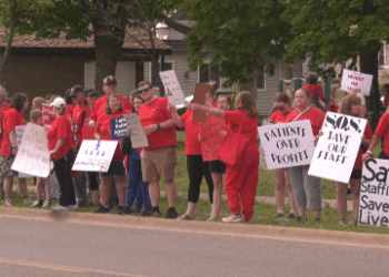 They lined the roadway along Washington Street in Downtown Marquette. Nurses and health care workers rallied today calling for fair contracts that prioritize patients over profits.
