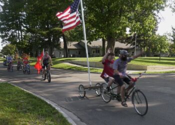 Co-founder Tom Nault leads the Patriotic Pedal Parade