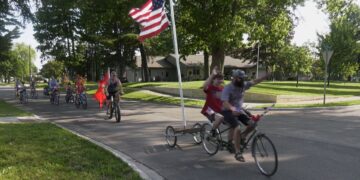 Co-founder Tom Nault leads the Patriotic Pedal Parade