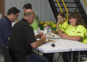Two of the camp's five female students network with local professionals