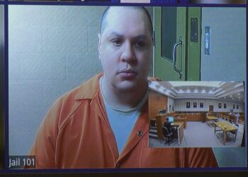 Jackson appears in court from the Delta County Jail via Zoom.
