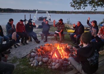 Members gather for a Men's Circle weekend kickoff