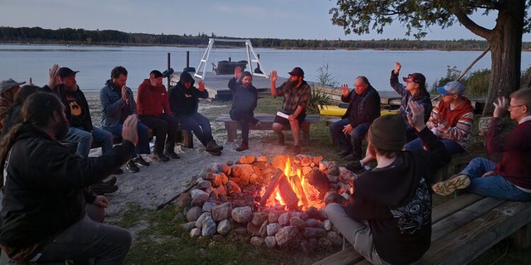 Members gather for a Men's Circle weekend kickoff