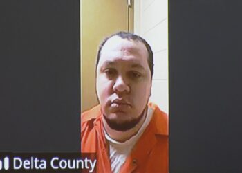 Jackson appeared in court from the Delta County Jail via Zoom