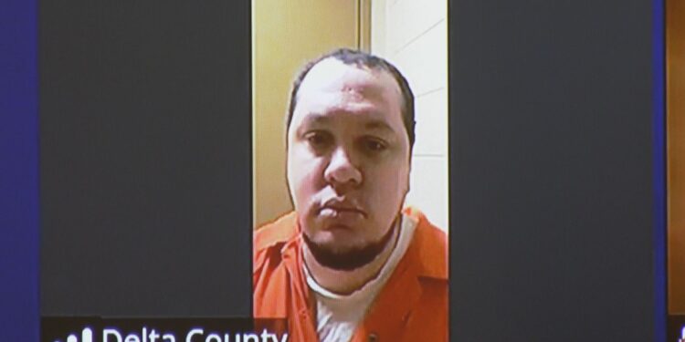 Jackson appeared in court from the Delta County Jail via Zoom