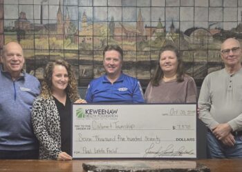 Jenn Jenich-Laplander, Executive Director of the Keweenaw Health Foundation presents a $7,570 check to Mark Paulson, Calumet High School Baseball Coach, David Yeo, Calumet Township Trustee, Lana Hyrkas, Calumet Township Treasurer, and Tim Gasprich, Calumet Township Supervisor. Image courtesy of the Keweenaw Health Foundation.