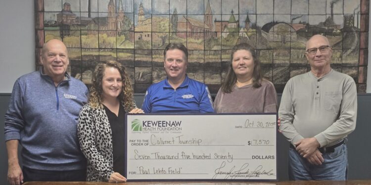 Jenn Jenich-Laplander, Executive Director of the Keweenaw Health Foundation presents a $7,570 check to Mark Paulson, Calumet High School Baseball Coach, David Yeo, Calumet Township Trustee, Lana Hyrkas, Calumet Township Treasurer, and Tim Gasprich, Calumet Township Supervisor. Image courtesy of the Keweenaw Health Foundation.