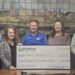 Jenn Jenich-Laplander, Executive Director of the Keweenaw Health Foundation presents a $7,570 check to Mark Paulson, Calumet High School Baseball Coach, David Yeo, Calumet Township Trustee, Lana Hyrkas, Calumet Township Treasurer, and Tim Gasprich, Calumet Township Supervisor. Image courtesy of the Keweenaw Health Foundation.