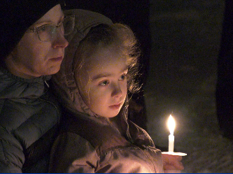 The evening included songs, meditation, and a sermon by a Buddhist priest. However, most of the night was spent reaffirming democracy by directing most of their rhetoric toward elected officials.