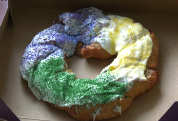 King cakes, which celebrate the three wise men, are decorated in purple for justice, green for faith, and gold for royalty, and with the baby signifying Jesus.
