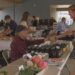 Rod Lanaville of Lanaville Garlic Farm makes a sale a the first market of the year.