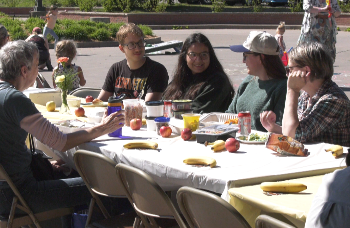 A simple meal can go a long way toward bringing people together. That's the idea behind Marquette's longest table community picnic, part of this year's Spread Goodness Day celebration.