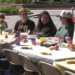 A simple meal can go a long way toward bringing people together. That's the idea behind Marquette's longest table community picnic, part of this year's Spread Goodness Day celebration.
