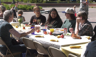 A simple meal can go a long way toward bringing people together. That's the idea behind Marquette's longest table community picnic, part of this year's Spread Goodness Day celebration.