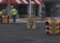 A team from the City of Escanaba Electric Department works to get the traffic signals up and running again.