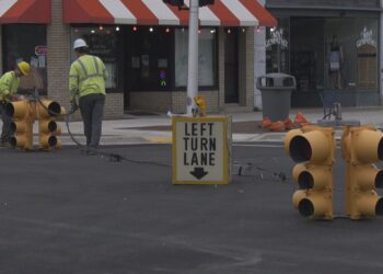 A team from the City of Escanaba Electric Department works to get the traffic signals up and running again.
