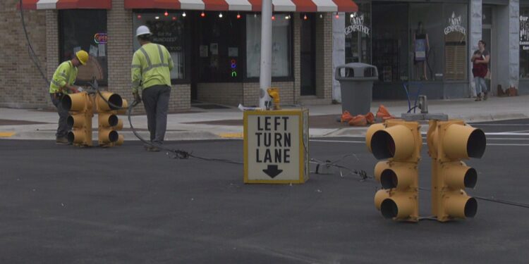 A team from the City of Escanaba Electric Department works to get the traffic signals up and running again.