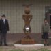 Student designers James Johnsen and Izayah Harris pose with the sculpture